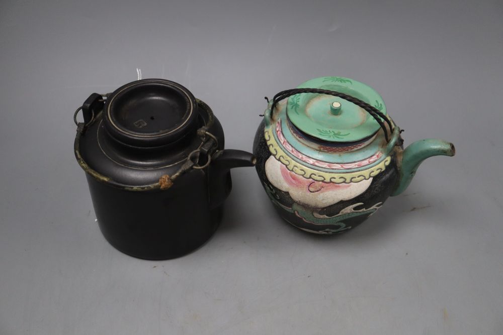 A Chinese enamelled Yixing teapot, height 13cm and a black Yixing teapot